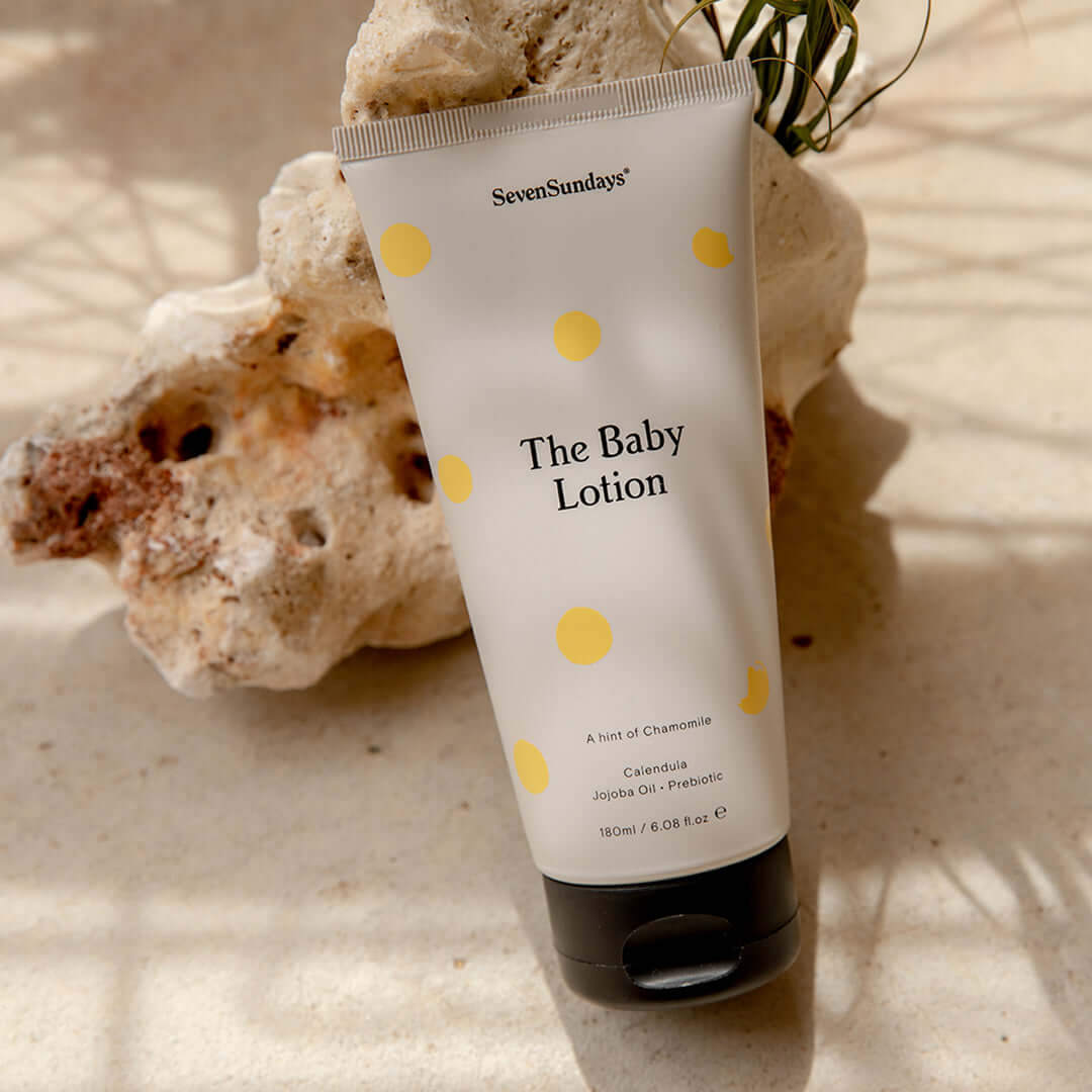 the baby lotion bottle with rocks and sand